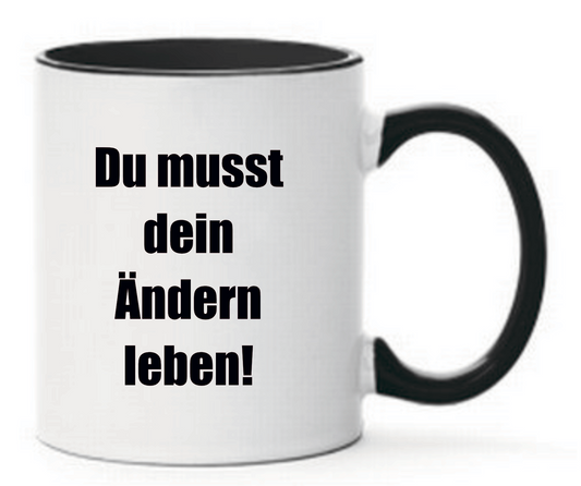 Schwarze Tasse mit Spruch Du musst dein Ändern leben